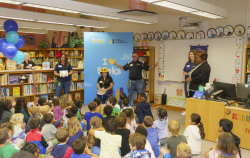 RIF kids gathered around for an I heart books event