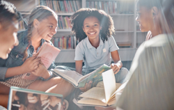 Children sitting together in library