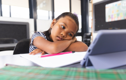 young girl watching ipad learning technology