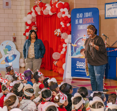 Author smiling joy of reading book event with KIA and RIF