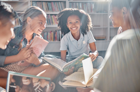 Children sitting together in library