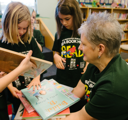 RIF volunteer book distribution event with children