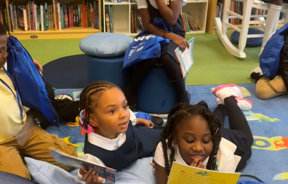 Macys RIF Detroit book event smiling girl at library refresh