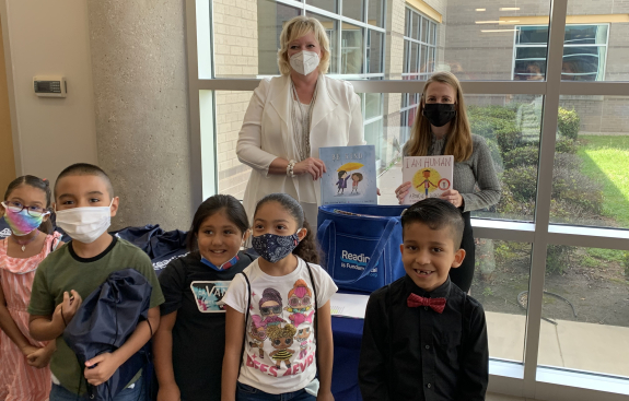 Group with books, it takes a village to support children literacy in US 