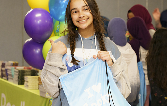 Girl smiling at RIF event