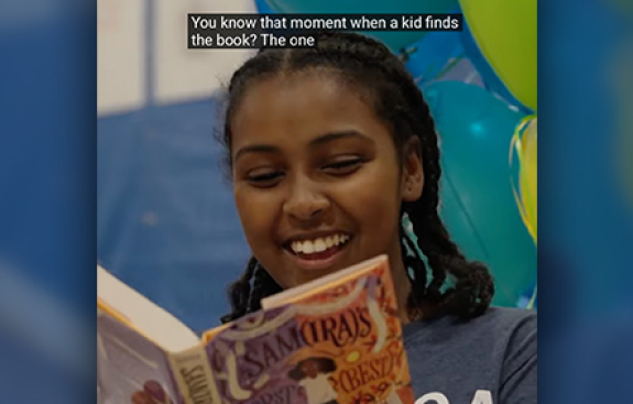Happy middleschooler with a book