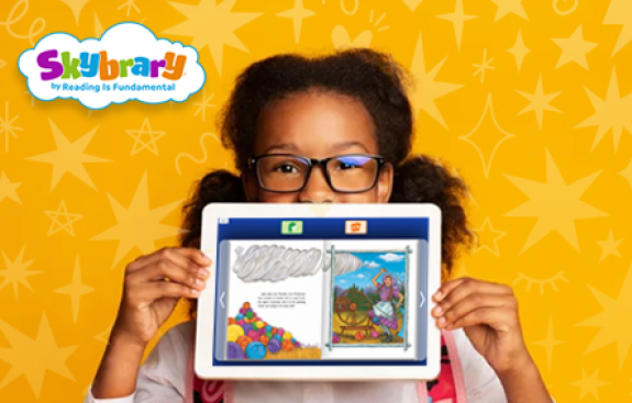 Girl holding up a tablet with a yellow starry background