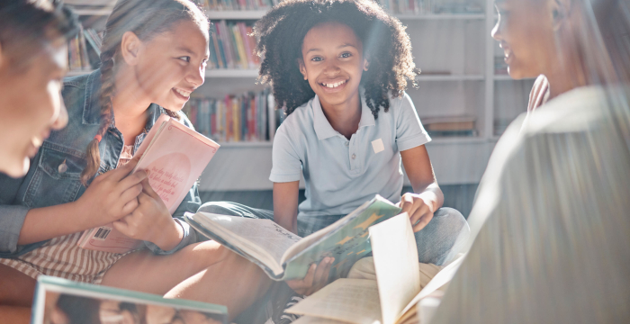 Children sitting together in library