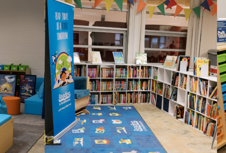 A set of three images. From left to right, they show a library reading center, a set of bookshelves around a custom rug, and a pair of girls reading in the newly created reading center.