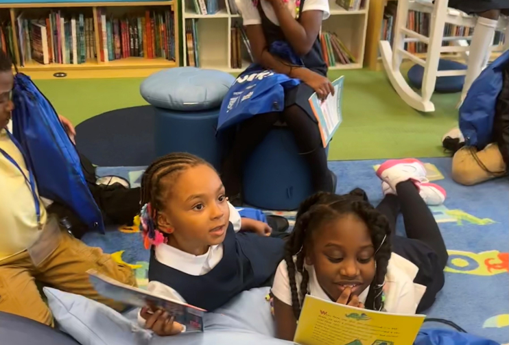 Macys RIF Detroit book event smiling girl at library refresh