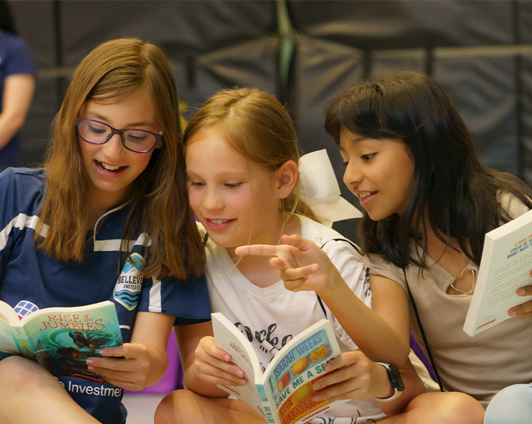 Girls reading books together